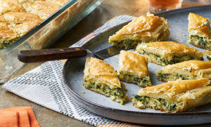 Spinach Pastry Diamonds plated next to serving dish