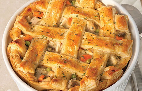 An image of prepared The Ultimate Chicken Pot Pie made with carrots, onions, mushrooms, Swanson® Chicken Broth, chicken and Pepperidge Farm® Puff Pastry Sheets.