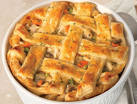 An image of prepared The Ultimate Chicken Pot Pie made with carrots, onions, mushrooms, Swanson® Chicken Broth, chicken and Pepperidge Farm® Puff Pastry Sheets.